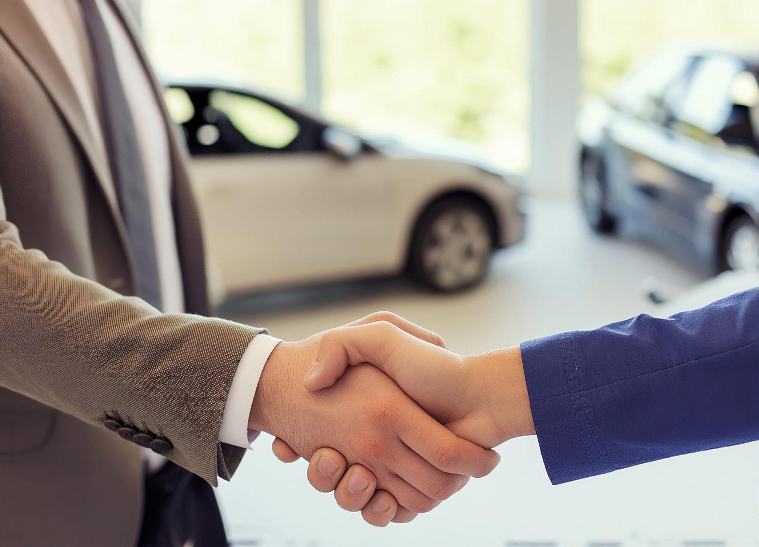 vecteezy_close-up-of-handshake-in-the-car-dealership-offices_47006784-scaled.jpg